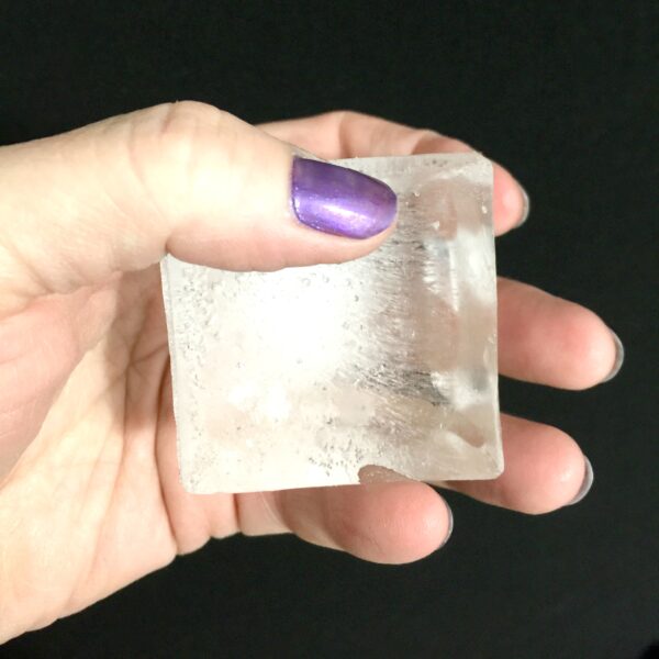 Hand Holding Ice Cube from Silicone Ice Tray